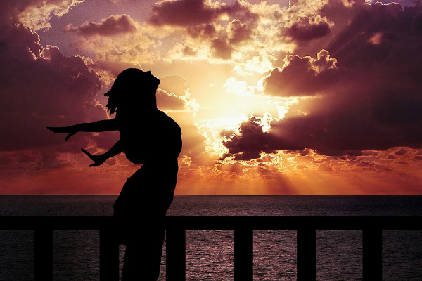 woman breathing sunset
